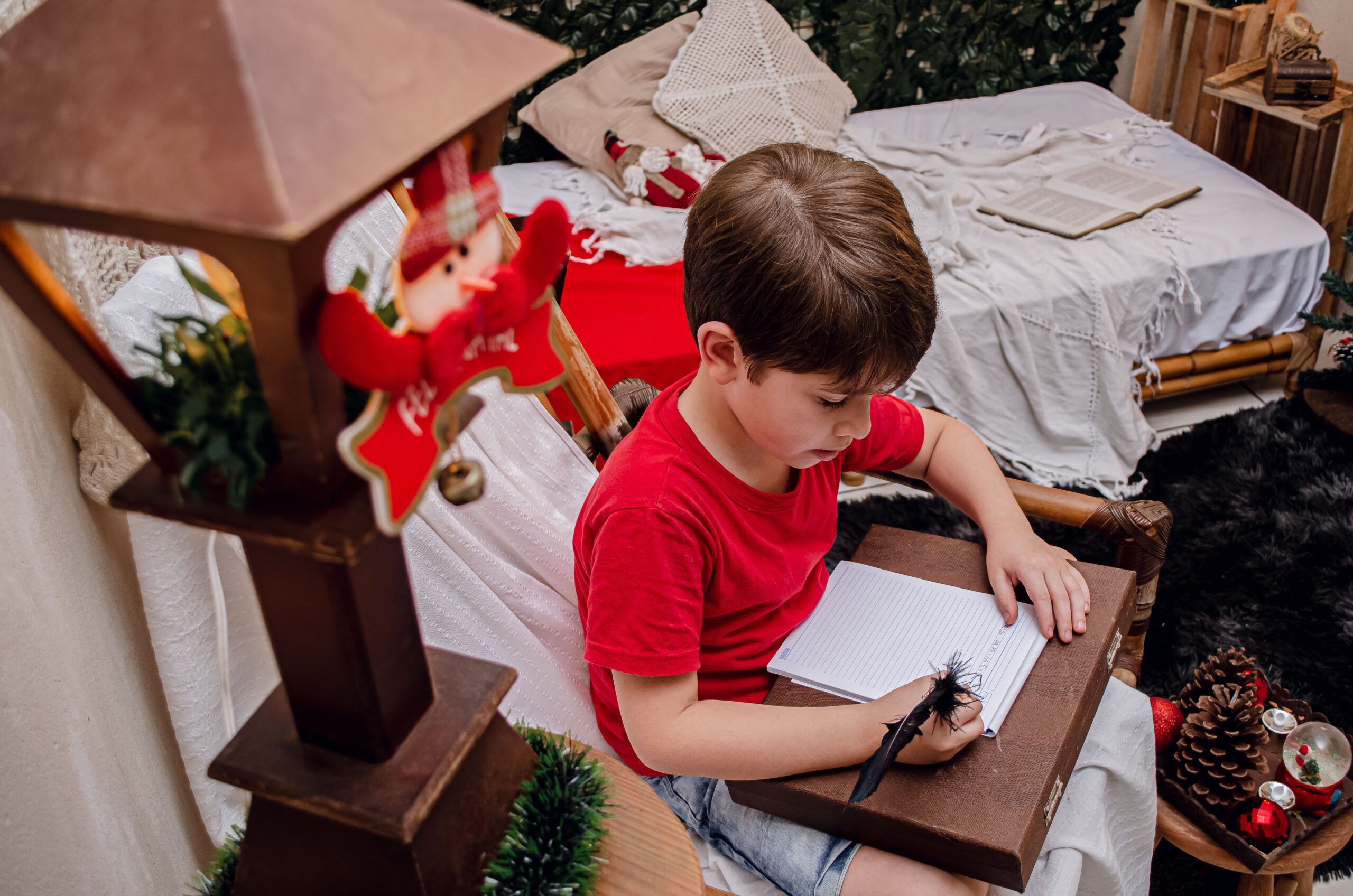 Boy writing a Christmas message